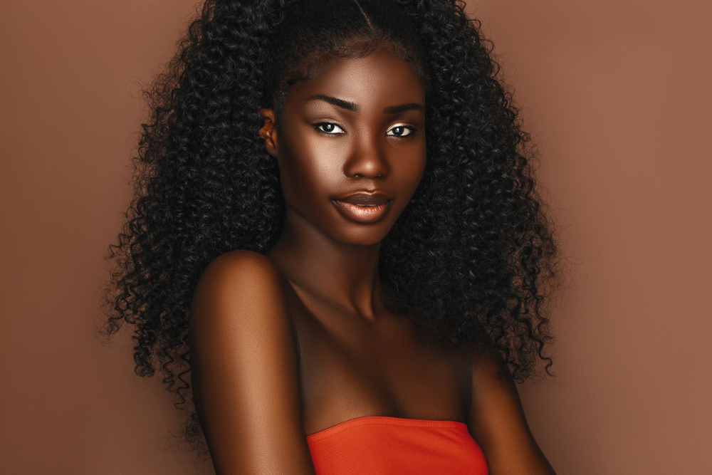 How can dark-skinned black women change how they're treated in society?